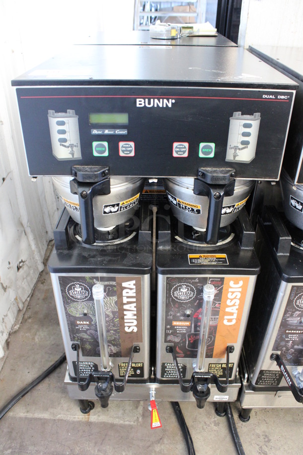 2012 Bunn Model DUAL SH DBC Stainless Steel Commercial Countertop Dual Coffee Machine w/ Hot Water Dispenser, 2 Stainless Steel Brew Baskets and 2 Bunn Model SH SERVER Satellite Servers. 120/208-240 Volts, 1 Phase. 18x24x36. Tested and Working!