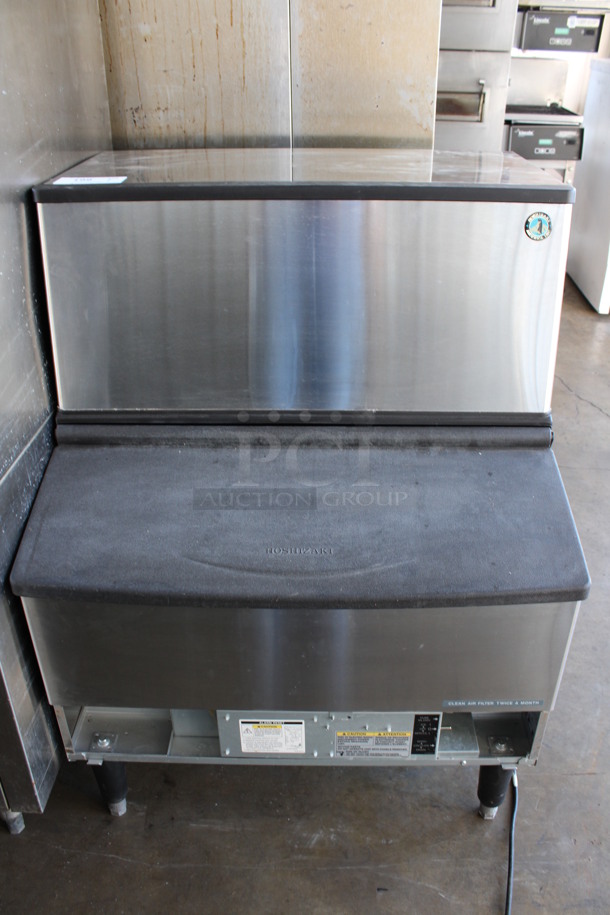 2015 Hoshizaki Model KM-260BAH Stainless Steel Commercial Self Contained Air Cooled Crescent Ice 260 Pound Capacity Ice Machine. 115 Volts, 1 Phase. 30x29x40