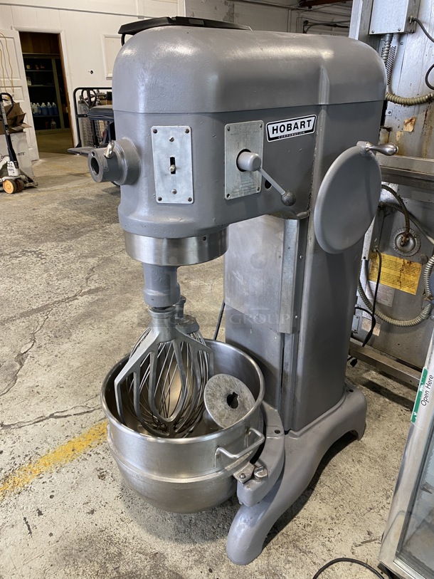 Hobart Model H 600 Metal Commercial Floor Style 60 Quart Planetary Mixer w/ Stainless Steel Mixing Bowl. Whisk, Paddle and Dough Hook Attachments. 220 Volts, 3 Phase. 25x38x56