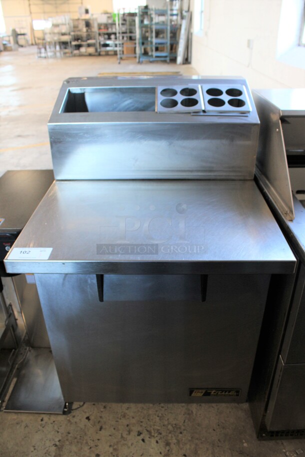 2012 True Model TSSU-27-12M-C Stainless Steel Commercial Work Top Cooler w/ Bar Topping Rail on Commercial Casters. 115 Volts, 1 Phase. 28x34.5x48. Tested and Working!