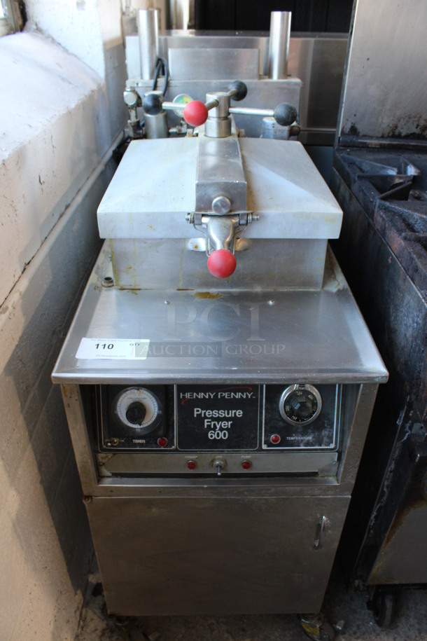 Henny Penny Model 600 Stainless Steel Commercial Floor Style Natural Gas Powered Pressure Fryer on Commercial Casters. 80,000 BTU. 18x41x50