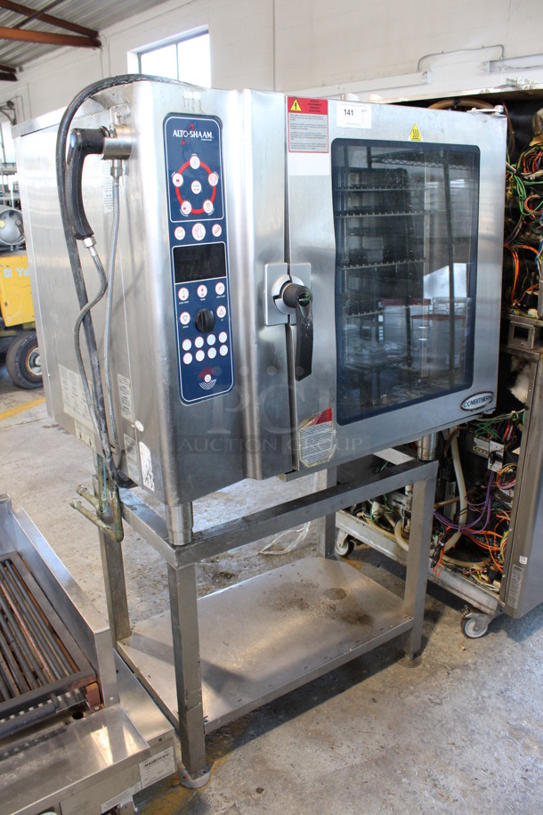2010 Alto Shaam Model 10.10 ES Stainless Steel Commercial Combitherm Convection Oven w/ Metal Racks on Metal Equipment Stand. 208-240 Volts, 3 Phase. 45x34x70