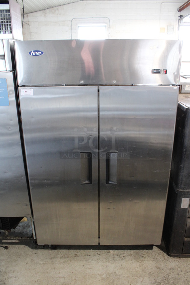 2017 Atosa Model MBF8002 Stainless Steel Commercial 2 Door Reach In Freezer w/ Poly Coated Racks on Commercial Casters. 115 Volts, 1 Phase. 52x32x83. Tested and Working!