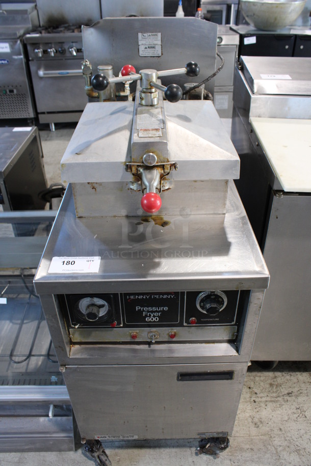 Henny Penny Model 600 Stainless Steel Commercial Floor Style Natural Gas Powered Pressure Fryer on Commercial Casters. 80,000 BTU. 18x38x49