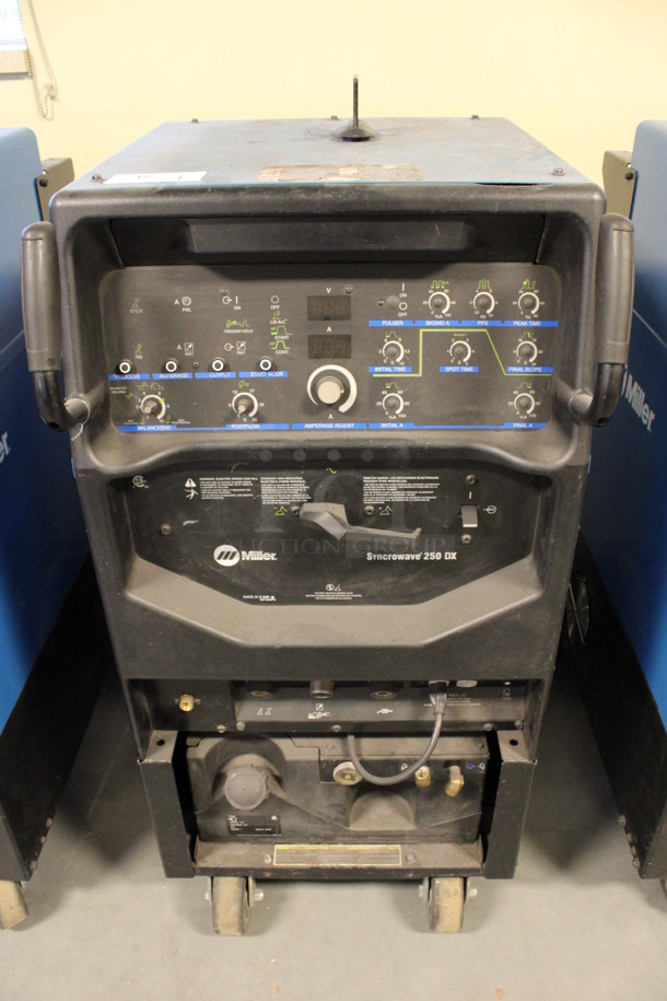 Miller Syncrowave 250 DX Metal Floor Style TIG Welding Machine on Commercial Casters. 115 Volts, 1 Phase. 28x42x50. (Room 130)