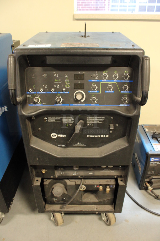 Miller Syncrowave 250 DX Metal Floor Style TIG Welding Machine on Commercial Casters. 115 Volts, 1 Phase. 28x42x50. (Room 130)