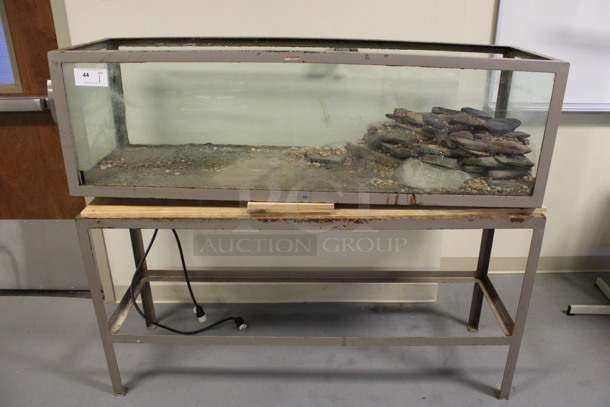 Brown Metal Countertop Reptile Tank on Brown Metal Table. 60x18x50. Tank: 60x18x18. (Room 130)