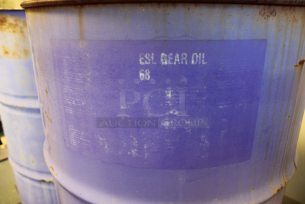 2 Metal Oil Barrels Full Of Liquid. Barrels Are Labeled as AW 46 Hydraulic Oil and ESL Gear Oil. 23x23x25. 2 Times Your Bid! (Room 130) - Image 6 of 6