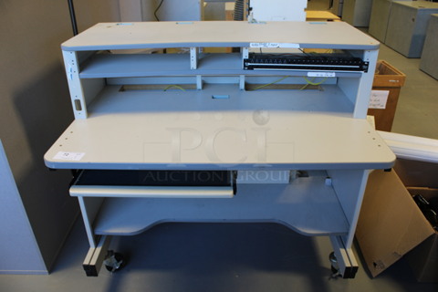 Gray Desk on Casters. 48x32x44. (Room 130)