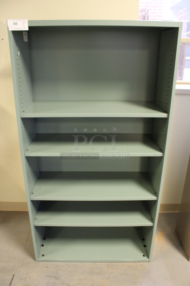 Green Metal 4 Tier Bookshelf. 36x15x67. (Room 130)