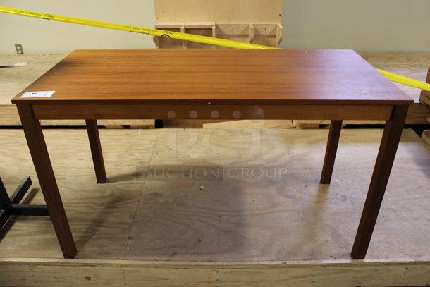 Wooden Table. 51x24x29. (Room 130)