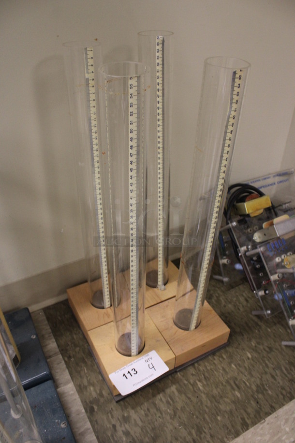 4 Tubes Stationed In Wooden Blocks. 5x5x22. 4 Times Your Bid! (Room 105) - Image 3 of 4
