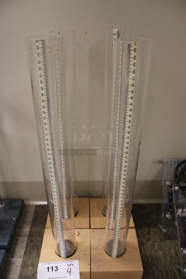 4 Tubes Stationed In Wooden Blocks. 5x5x22. 4 Times Your Bid! (Room 105) - Image 4 of 4