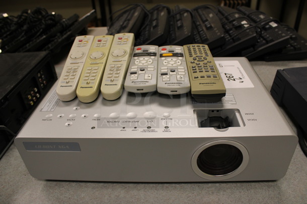 Panasonic Model PT-LB80NTU LCD Projector w/ 6 Various Remotes. 14.5x9x4. (Room 105)