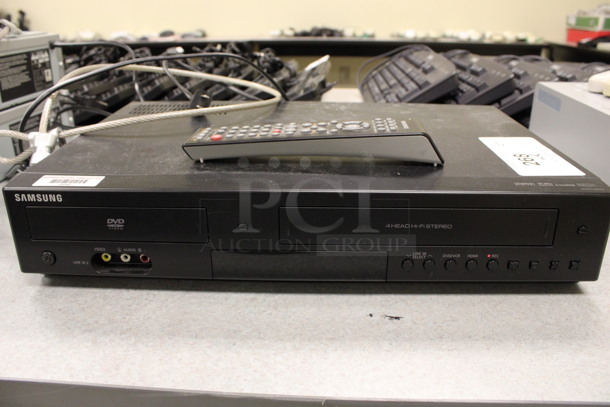 Samsung Model DVD-V9800 VCR and DVD Player w/ Remote. 17x11x3.5. (Room 105)