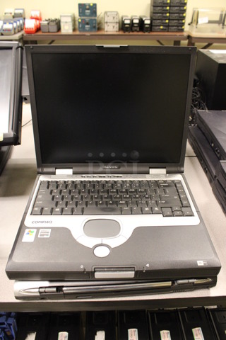 2 Compaq Evo N1015v 15" Laptops w/ 1 Charger. 13x10.5x2. 2 Times Your Bid! (Room 105)