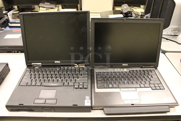 2 Various Dell 14" Laptops w/ 2 Chargers. Inspiron 7000 and Latitude D630. 13.5x10.5x1.5, 12.5x10x2. 2 Times Your Bid! (Room 105) - Image 1 of 8