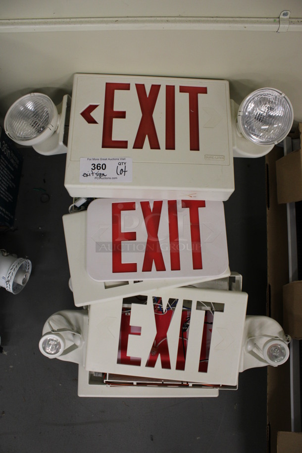 ALL ONE MONEY! Lot of Exit Signs and Extra Pieces! Includes 23x3x10. (Basement: Room 019)