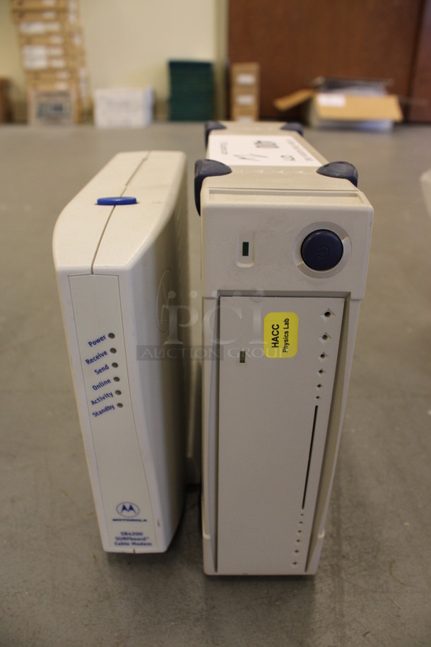 2 Various Items; Motorola Model SB4200 Cable Modem and Unit. 10x2.5x8, 2.5x8x7. 2 Times Your Bid! (Basement: Room 019)