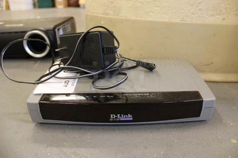 D-link Model Di-713P Wireless Gateway. 9x5.5x1.5. (Basement: Room 019)