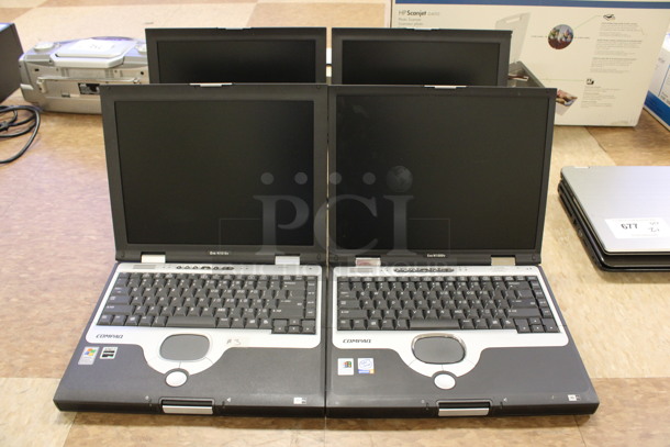 4 Compaq Evo N1000v 14" Laptops. 4 Times Your Bid! (Room 108) - Image 1 of 11