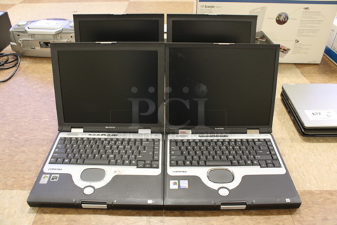 4 Compaq Evo N1000v 14" Laptops. 4 Times Your Bid! (Room 108)