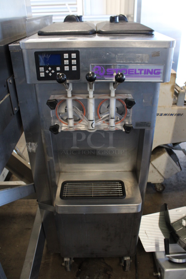2011 Stoelting Model F231-38I2 Stainless Steel Commercial Floor Style Air Cooled 2 Flavor w/ Twist Soft Serve Ice Cream Machine on Commercial Casters. 208-240 Volts, 1 Phase. 23x33x58