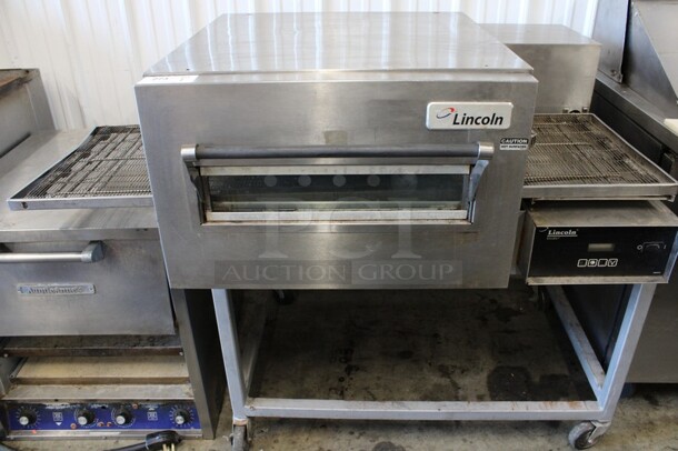 LATE MODEL! Lincoln Impinger Stainless Steel Commercial Conveyor Pizza Oven on Commercial Casters. 240 Volts, 1 Phase. 50x40x43.5