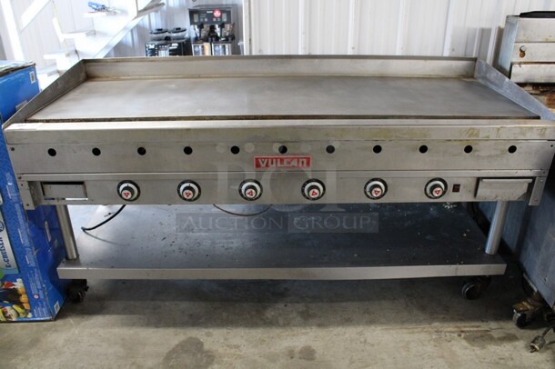 Vulcan Stainless Steel Commercial Natural Gas Powered Flat Top Griddle w/ Thermostatic Controls and Under Shelf on Commercial Casters. 72x32x38