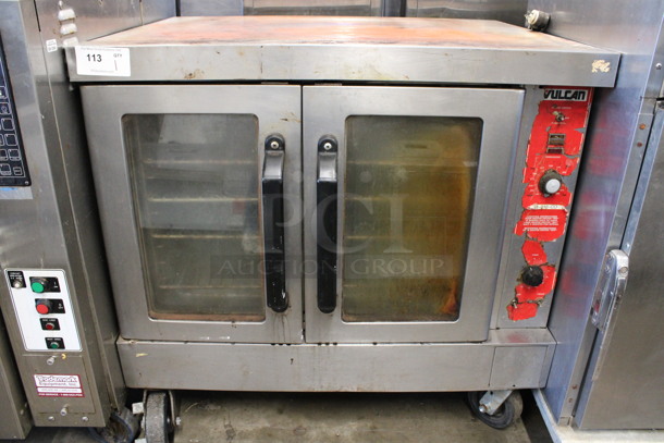 Vulcan Stainless Steel Commercial Natural Gas Powered Full Size Convection Oven w/ View Through Doors, Metal Oven Racks and Thermostatic Controls on Commercial Casters. 40.5x32x39
