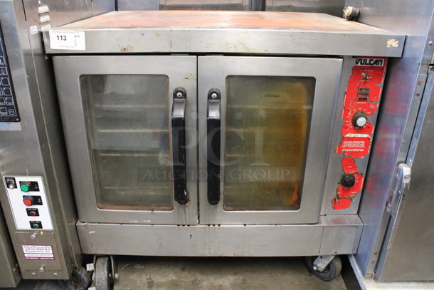 Vulcan Stainless Steel Commercial Natural Gas Powered Full Size Convection Oven w/ View Through Doors, Metal Oven Racks and Thermostatic Controls on Commercial Casters. 40.5x32x39 - Image 1 of 6