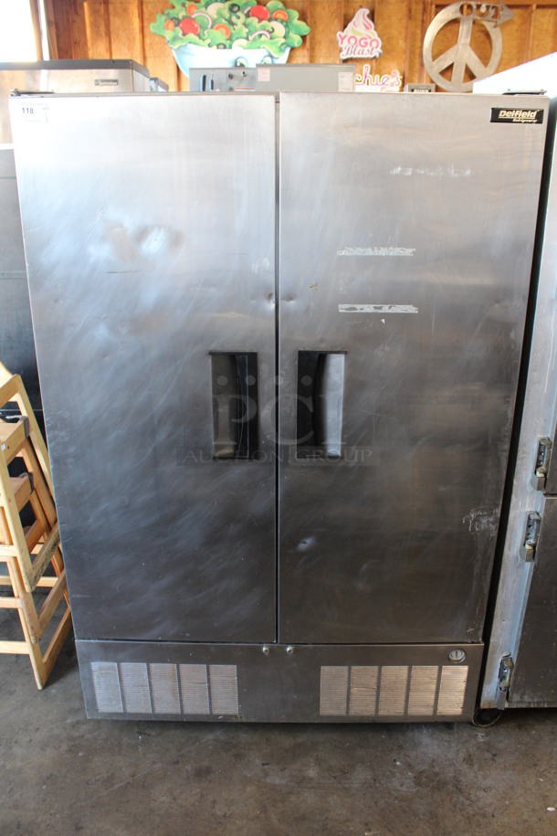 Delfield Stainless Steel Commercial 2 Door Reach In Cooler w/ Poly Coated Racks on Commercial Casters. 50.5x34x79. Tested and Powers On But Does Not Get Cold