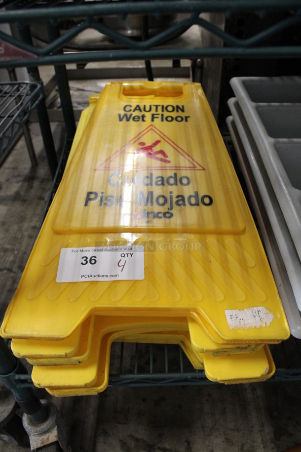 4 Yellow Poly Wet Floor Caution Signs; 1 Winco and 3 Rubbermaid. 12x1x25, 1x1x26. 4 Times Your Bid!