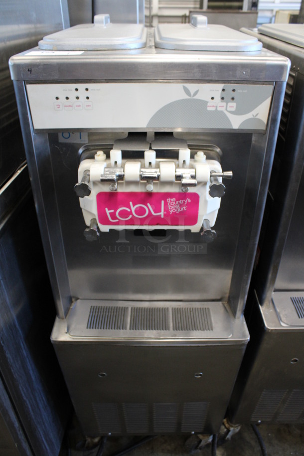 Taylor Model 794-33 Stainless Steel Commercial Floor Style Water Cooled 2 Flavor w/ Twist Soft Serve Ice Cream Machine on Commercial Casters. 208-230 Volts, 3 Phase. 20x34x59