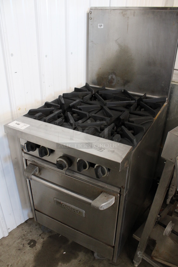 Garland Stainless Steel Commercial Natural Gas Powered 4 Burner Range w/ Oven and Backsplash on Commercial Casters. 24x35x57 - Image 2 of 5