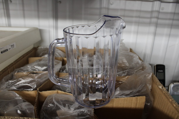12 BRAND NEW IN BOX! Clear Poly Pitchers! 6.5x4x6.5. 12 Times Your Bid! - Image 1 of 4