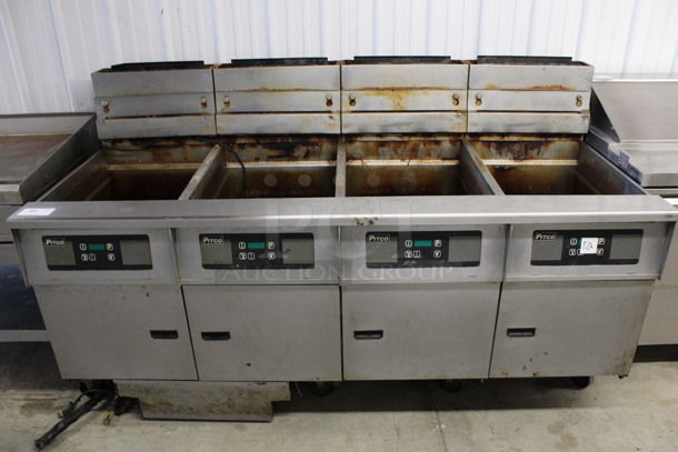 Pitco Frialator Model SG18 Stainless Steel Commercial Natural Gas Powered 4 Bay Deep Fat Fryer w/ Filtration System on Commercial Casters. 140,000 BTU. 79x34x47