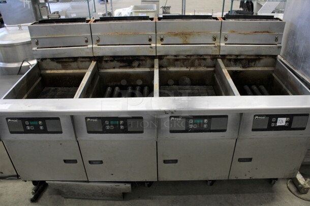 Pitco Frialator Model SG18 Stainless Steel Commercial Natural Gas Powered 4 Bay Deep Fat Fryer w/ Filtration System on Commercial Casters. 140,000 BTU. 79x35x46