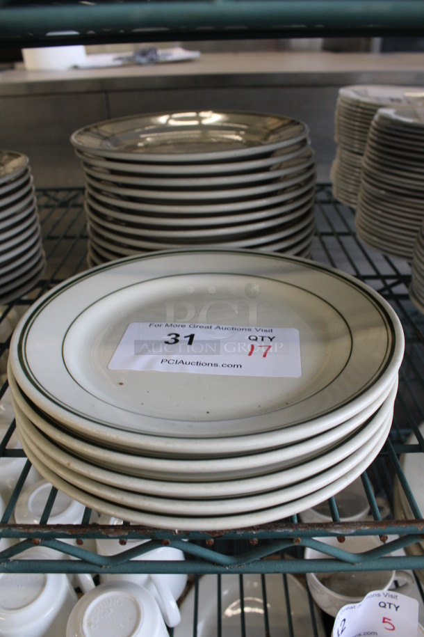 17 White Ceramic Plates w/ Green Lines on Rim. 8.25x8.25x1. 17 Times Your Bid!