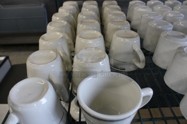 19 White Ceramic Mugs w/ Green Lines on Rim. 4x3x3. 19 Times Your Bid! - Image 2 of 3