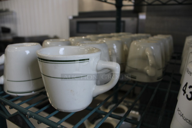 19 White Ceramic Mugs w/ Green Lines on Rim. 4x3x3. 19 Times Your Bid! - Image 3 of 3