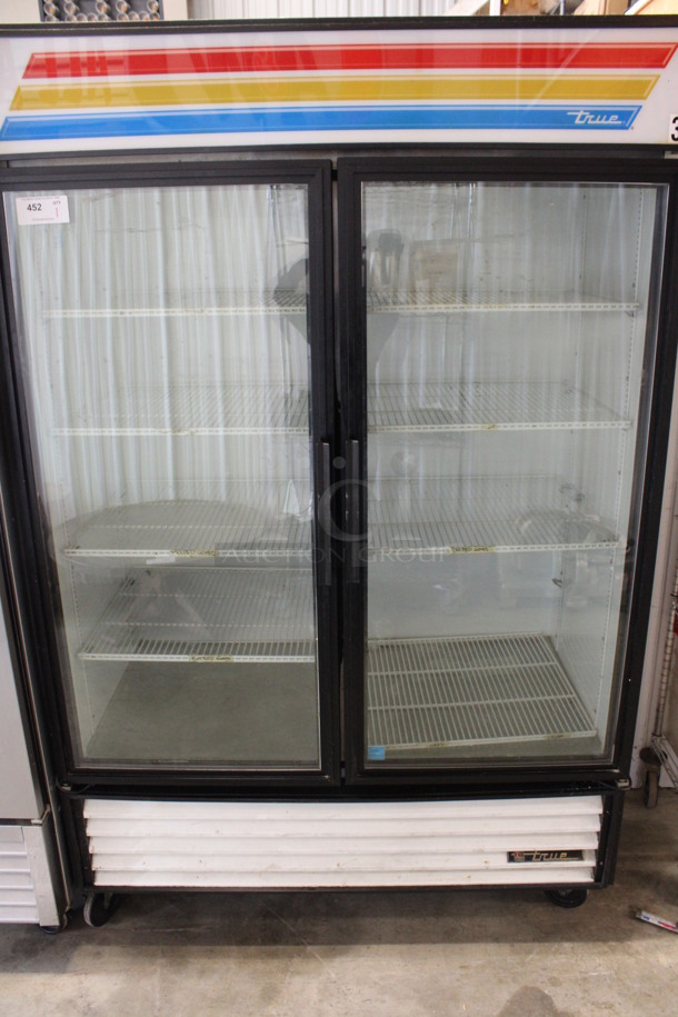 2014 True Model GDM-49-LD ENERGY STAR Metal Commercial 2 Door Reach In Cooler Merchandiser w/ Poly Coated Racks on Commercial Casters. 115 Volts, 1 Phase. 54x30x84. Tested and Working!