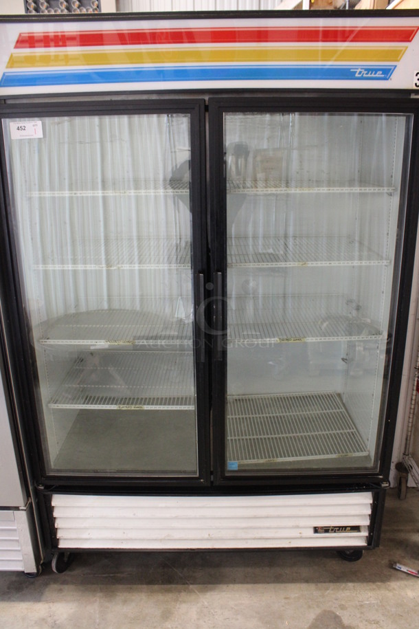 2014 True Model GDM-49-LD ENERGY STAR Metal Commercial 2 Door Reach In Cooler Merchandiser w/ Poly Coated Racks on Commercial Casters. 115 Volts, 1 Phase. 54x30x84. Tested and Working! - Image 1 of 6