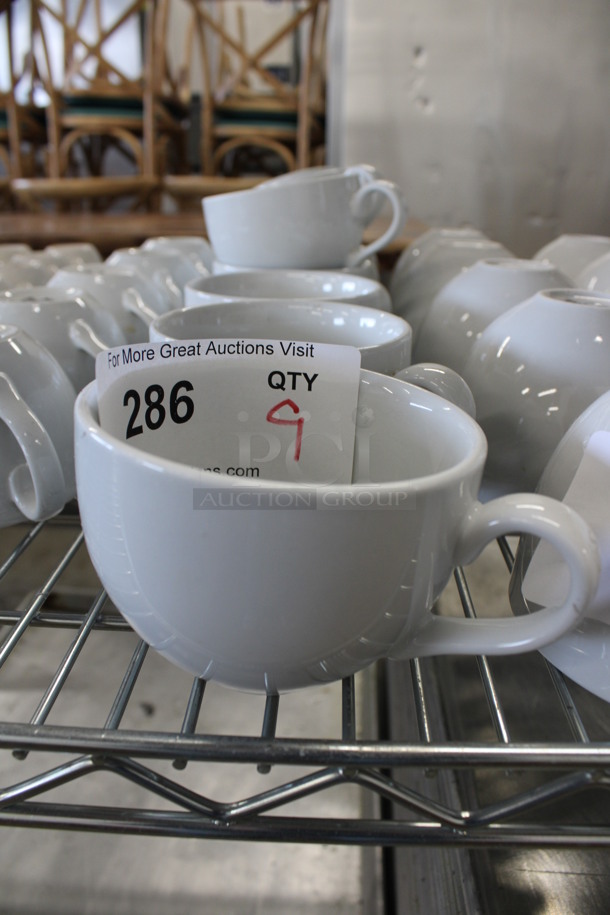 9 White Ceramic Mugs. 5x4x3. 9 Times Your Bid!