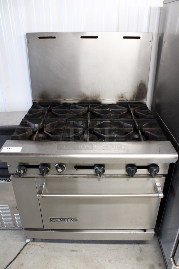 American Range Stainless Steel Commercial Natural Gas Powered 6 Burner Range w/ Oven and Backsplash. 36x33x57