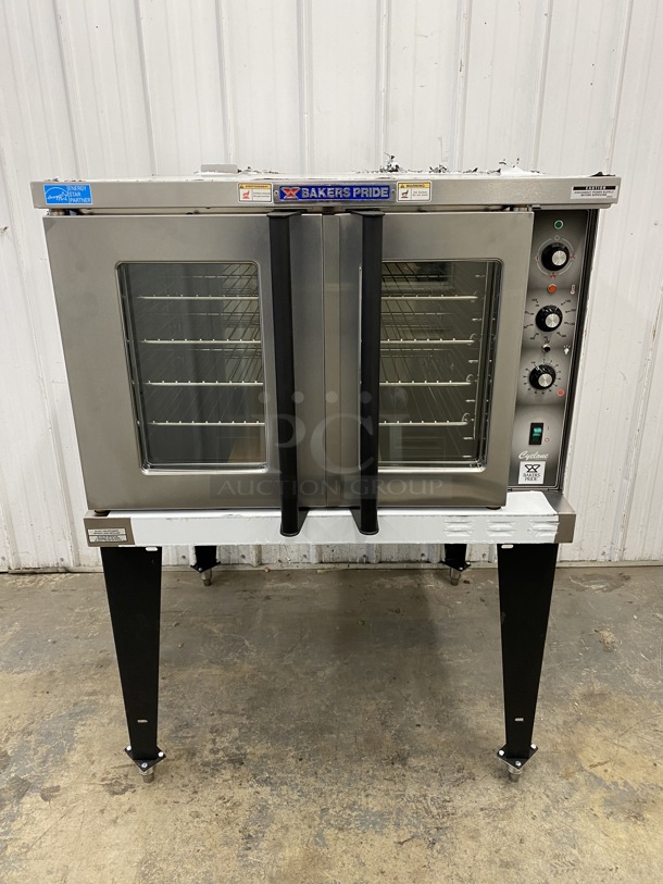 BRAND NEW! 2019 Baker's Pride Model BCO-E1 ENERGY STAR Stainless Steel Commercial Electric Powered Full Size Convection Oven w/ View Through Doors, Metal Oven Racks and Thermostatic Controls on Metal Legs. 240 Volts, 1 Phase. 38x39x55.5 - Image 2 of 12