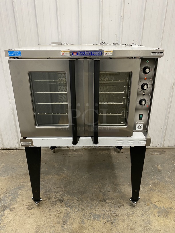 BRAND NEW! 2019 Baker's Pride Model BCO-E1 ENERGY STAR Stainless Steel Commercial Electric Powered Full Size Convection Oven w/ View Through Doors, Metal Oven Racks and Thermostatic Controls on Metal Legs. 240 Volts, 1 Phase. 38x39x55.5