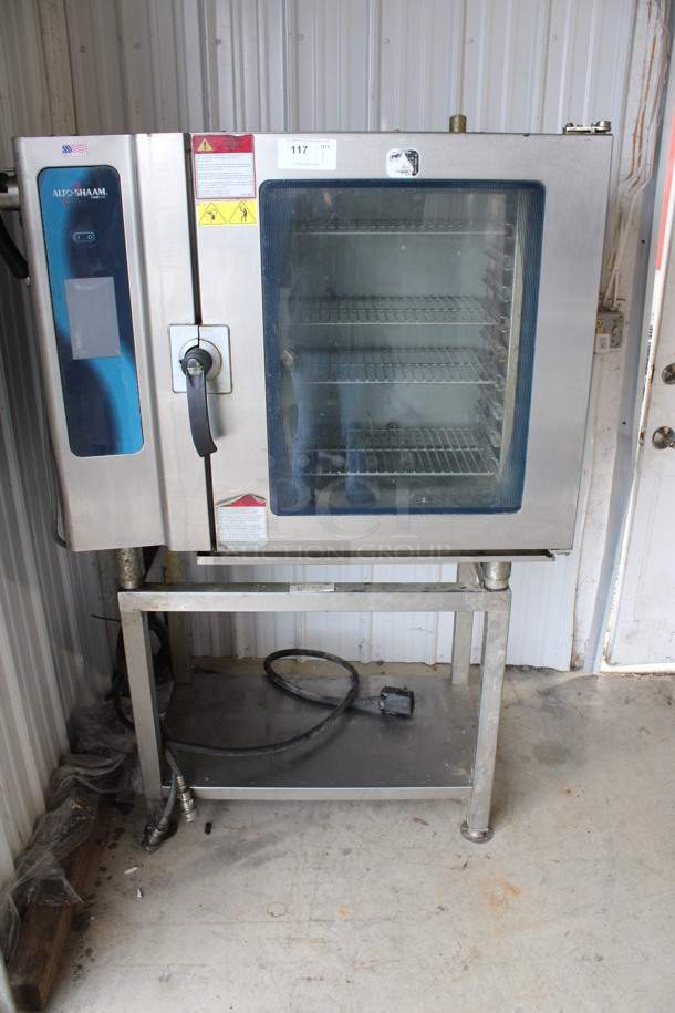 2013 Alto Shaam Model 10.10 ESI Stainless Steel Commercial Electric Powered Combitherm Convection Oven w/ View Through Door and Metal Oven Racks on Stainless Steel Equipment Stand. 208-240 Volts, 3 Phase. 46x32x69