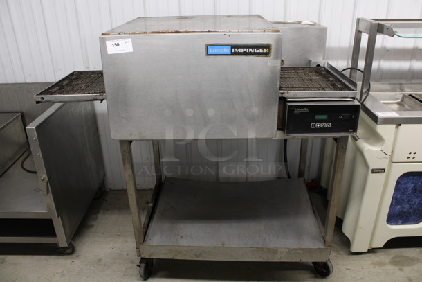 Lincoln Impinger Stainless Steel Commercial Electric Powered Conveyor Pizza Oven on Metal Stand w/ Commercial Casters. 480 Volts, 3 Phase. 58x36x54