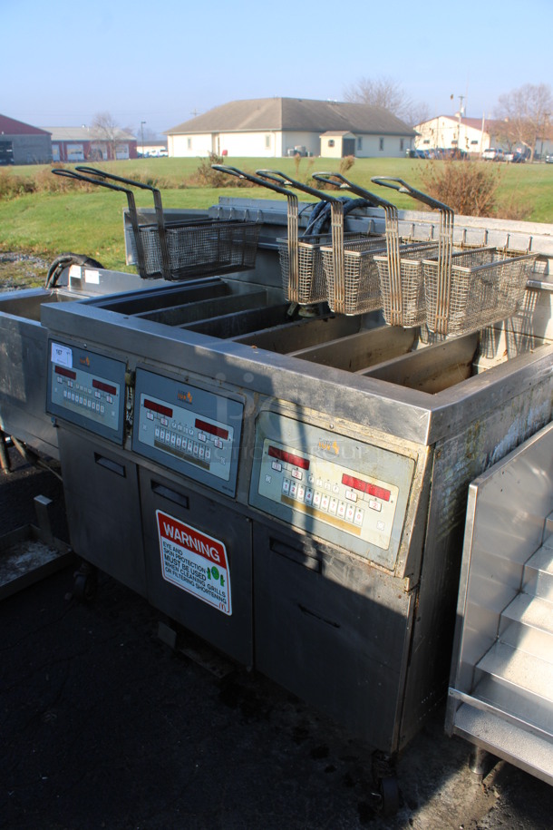 Henny Penny Model LVG-SSS Stainless Steel Commercial Floor Style Natural Gas Powered 3 Bay Deep Fat Fryer w/ 6 Metal Fry Baskets on Commercial Casters. 225,000 BTU. 47x32x48 - Image 2 of 8